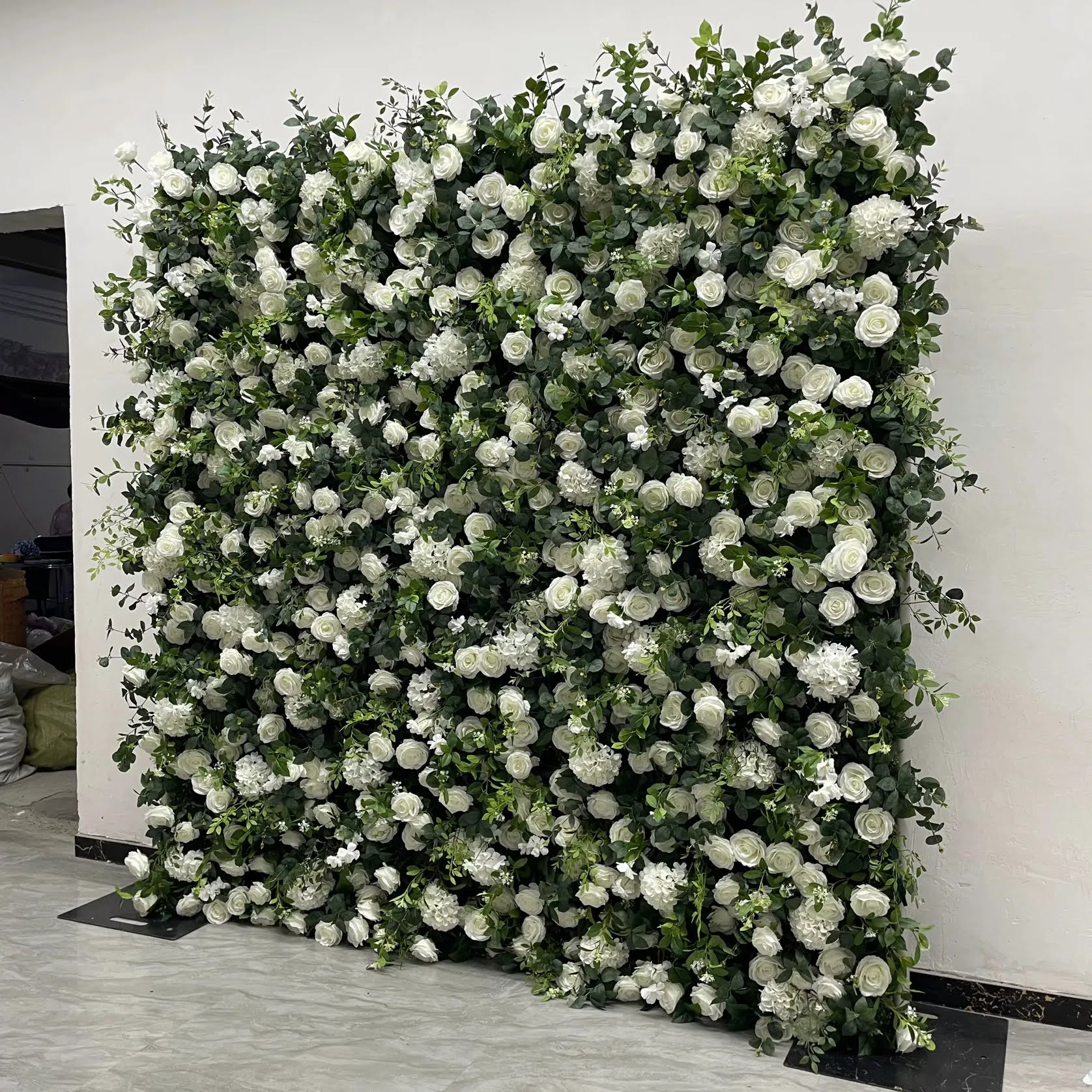 Angled view of the White and Green flower wall, showing the depth of its faux flowers